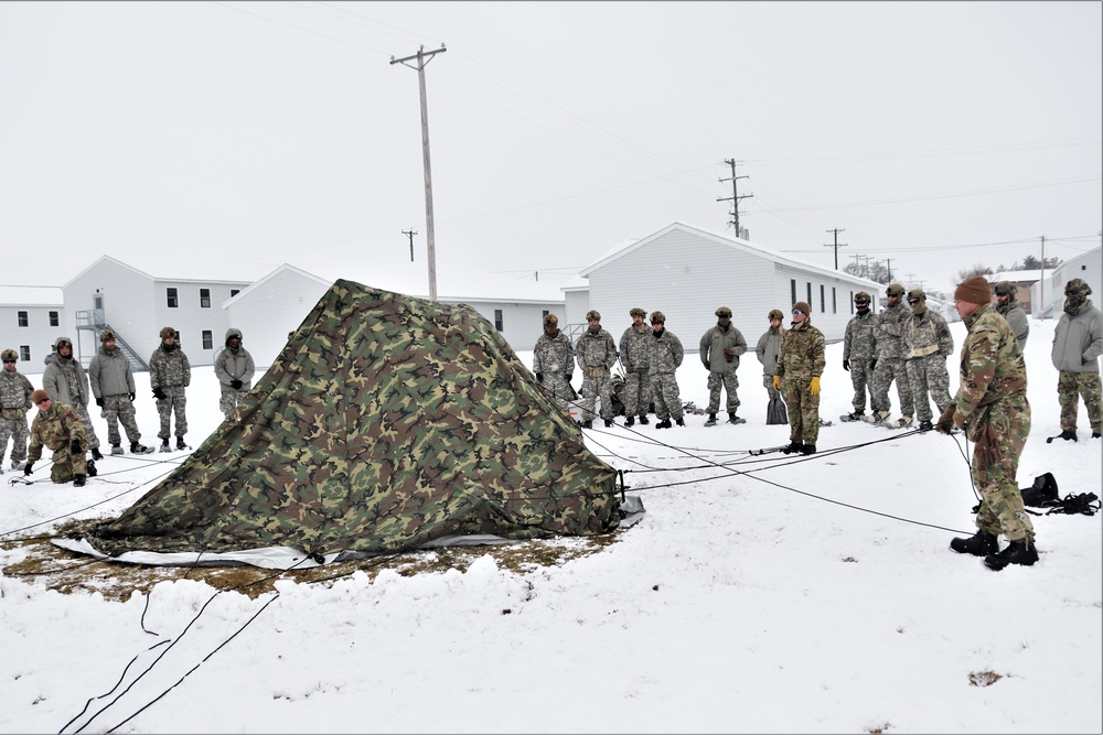 Tent-building among skills Airmen learned during January cold-weather training at Fort McCoy