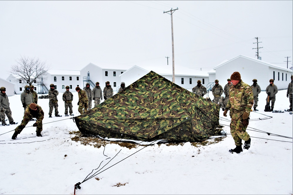 Tent-building among skills Airmen learned during January cold-weather training at Fort McCoy