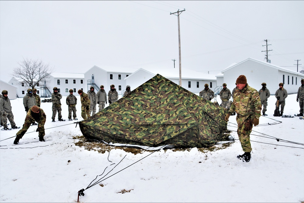 Tent-building among skills Airmen learned during January cold-weather training at Fort McCoy