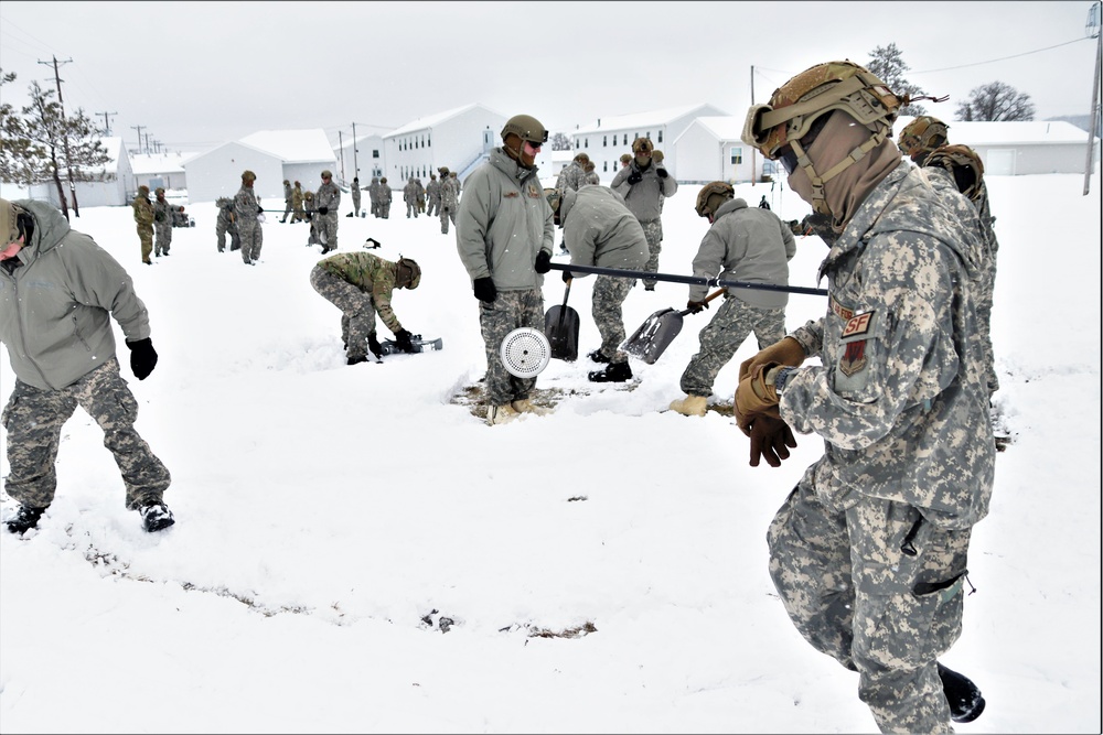Tent-building among skills Airmen learned during January cold-weather training at Fort McCoy