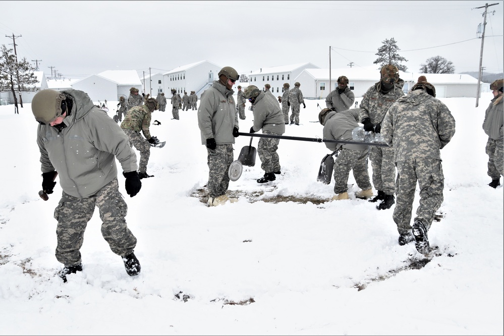 Tent-building among skills Airmen learned during January cold-weather training at Fort McCoy
