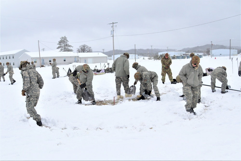 Tent-building among skills Airmen learned during January cold-weather training at Fort McCoy
