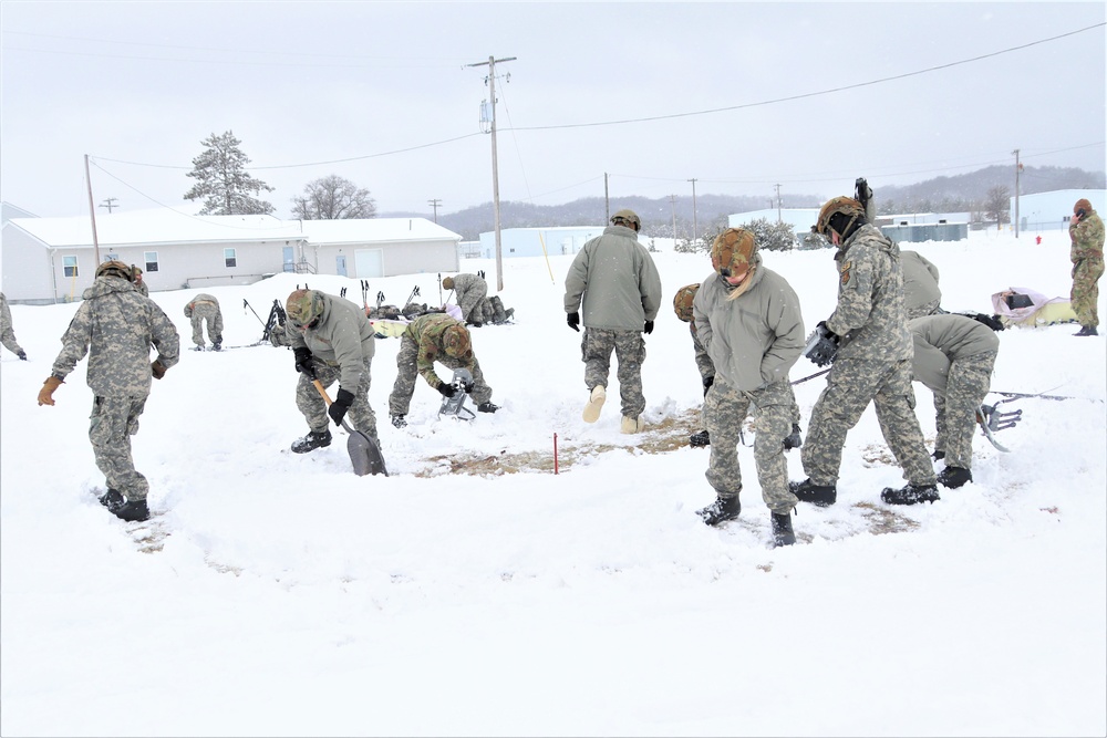 Tent-building among skills Airmen learned during January cold-weather training at Fort McCoy