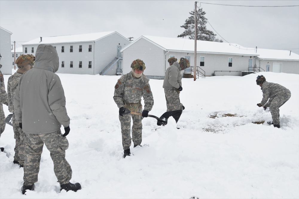 Tent-building among skills Airmen learned during January cold-weather training at Fort McCoy