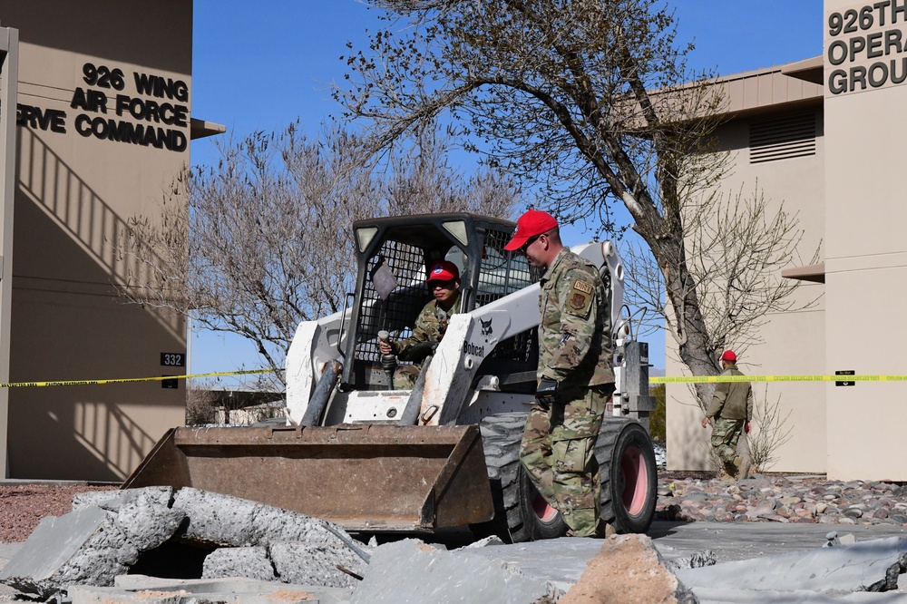 555th Red Horse Squadron demolishes 926th Wing building patio.