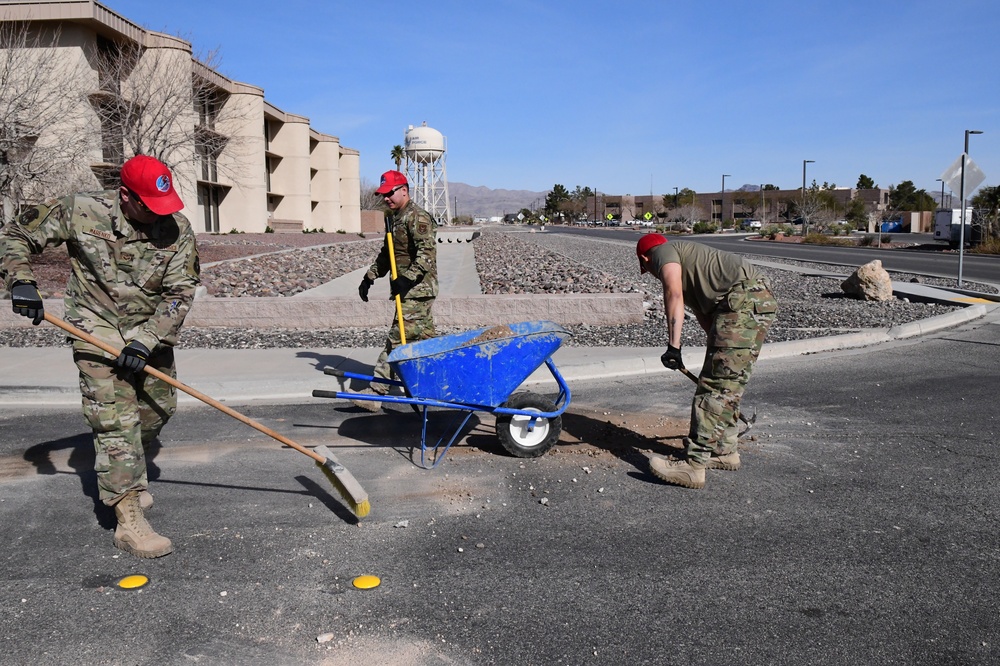 555th Red Horse Squadron demolishes 926th Wing building patio.