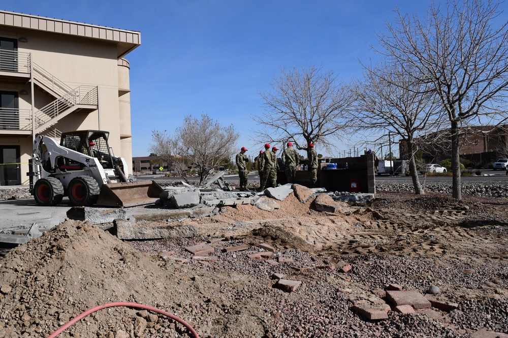 555th Red Horse Squadron demolishes 926th Wing building patio.