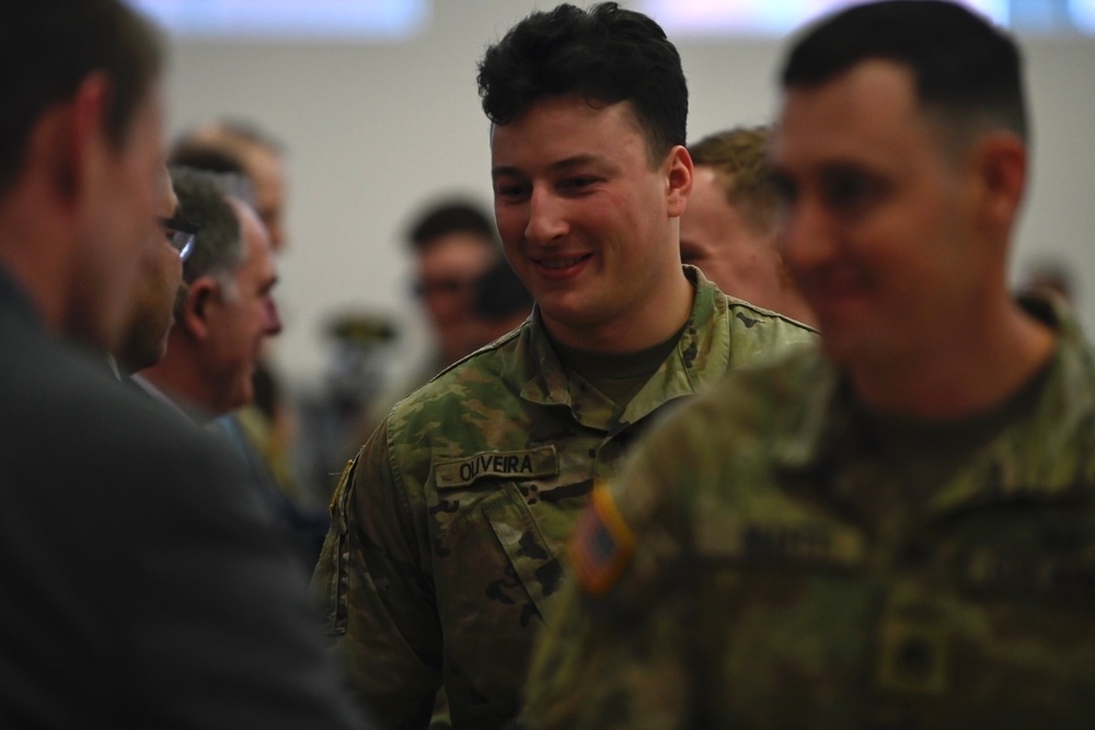 Soldiers from 82nd Cavalry Regiment shake hands with distinguished officials after demobilization ceremony