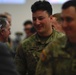 Soldiers from 82nd Cavalry Regiment shake hands with distinguished officials after demobilization ceremony