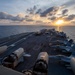 Nimitz Sailing During Sunset