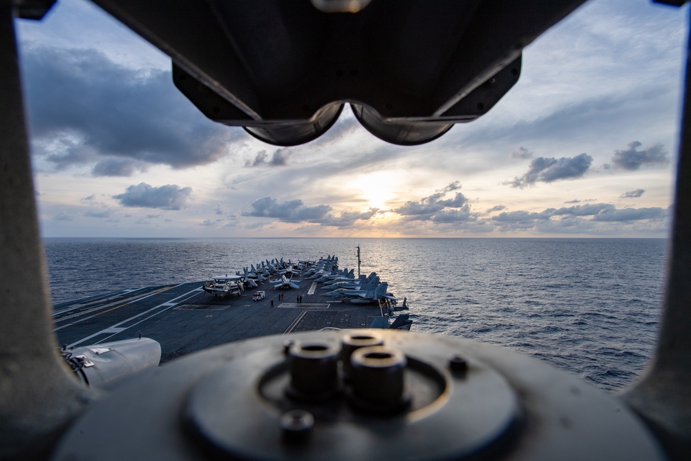 Nimitz Sailing During Sunset