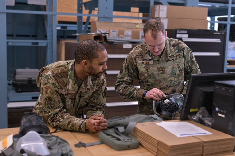 110th Wing service members check gas masks for any leaks