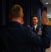 Newly promoted Senior Master Sgt. Brandan Trehal reaffirms his Oath of Enlistment