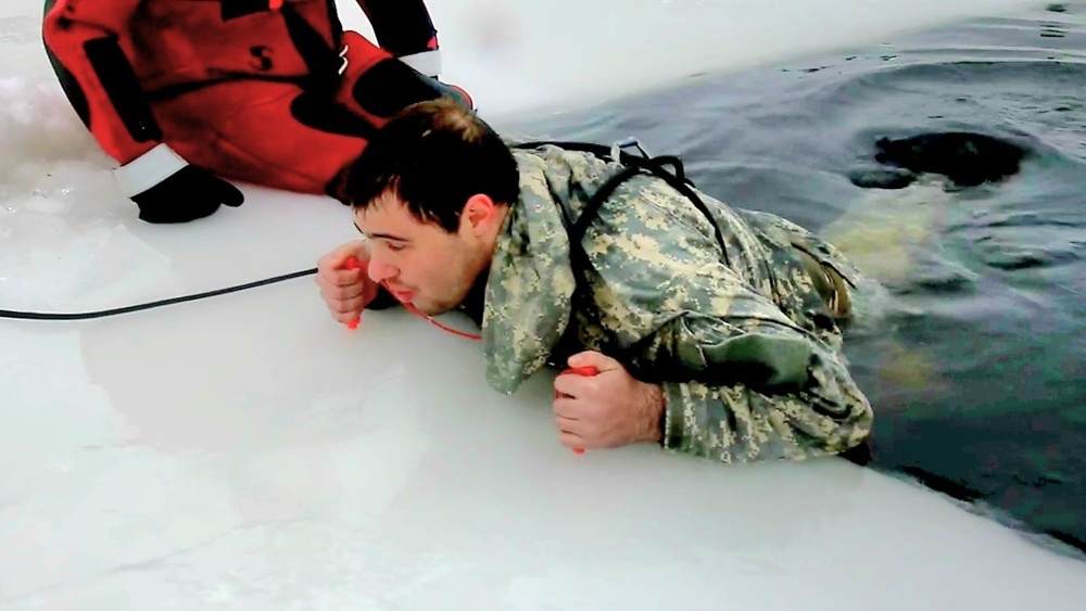 Airmen jump in icy Fort McCoy lake for January cold-water immersion training