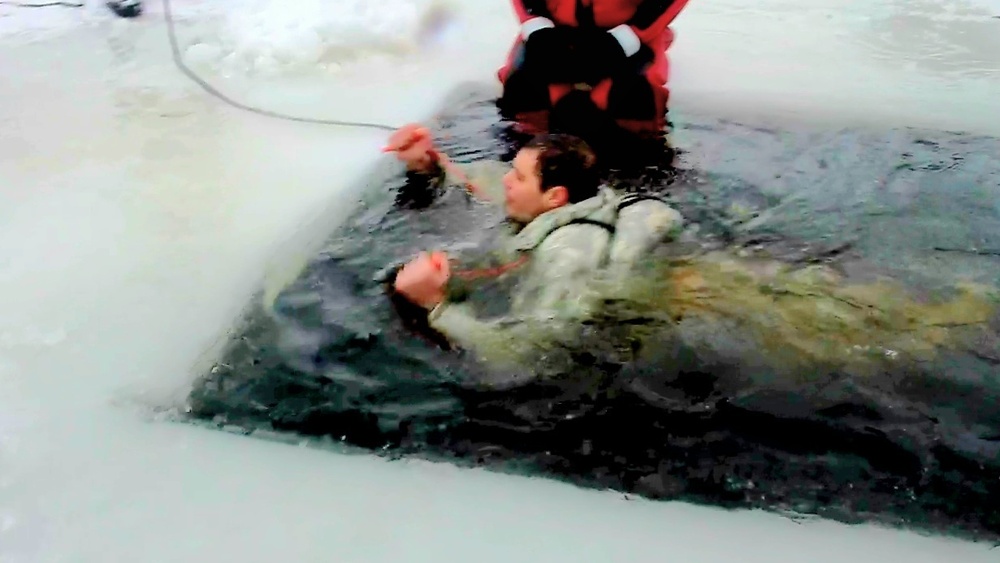 Airmen jump in icy Fort McCoy lake for January cold-water immersion training