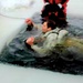 Airmen jump in icy Fort McCoy lake for January cold-water immersion training