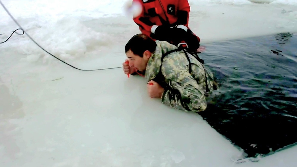 Airmen jump in icy Fort McCoy lake for January cold-water immersion training