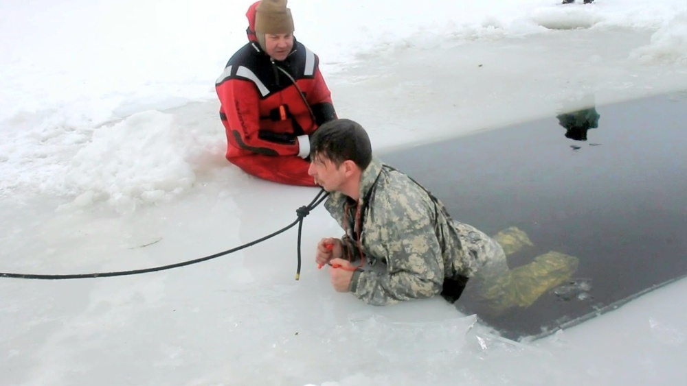 Airmen jump in icy Fort McCoy lake for January cold-water immersion training