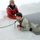 Airmen jump in icy Fort McCoy lake for January cold-water immersion training