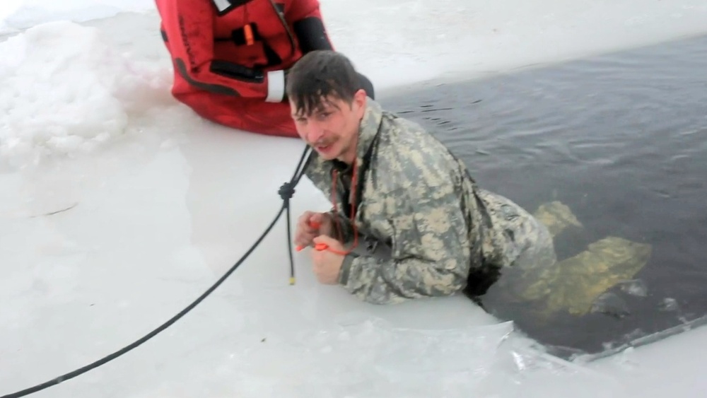 Airmen jump in icy Fort McCoy lake for January cold-water immersion training