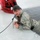Airmen jump in icy Fort McCoy lake for January cold-water immersion training