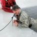 Airmen jump in icy Fort McCoy lake for January cold-water immersion training