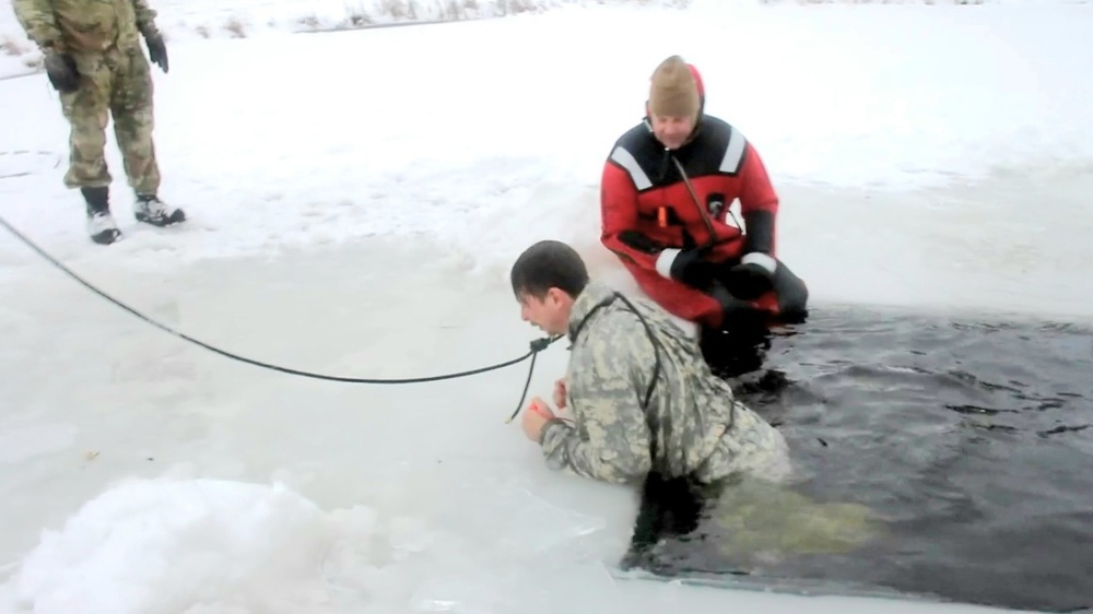 Airmen jump in icy Fort McCoy lake for January cold-water immersion training