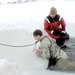 Airmen jump in icy Fort McCoy lake for January cold-water immersion training