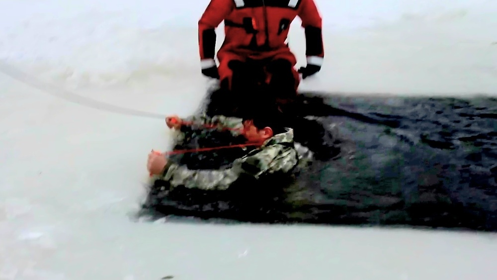 Airmen jump in icy Fort McCoy lake for January cold-water immersion training