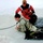 Airmen jump in icy Fort McCoy lake for January cold-water immersion training