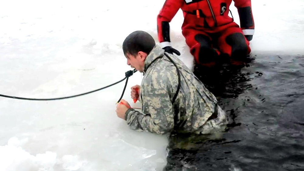 Airmen jump in icy Fort McCoy lake for January cold-water immersion training