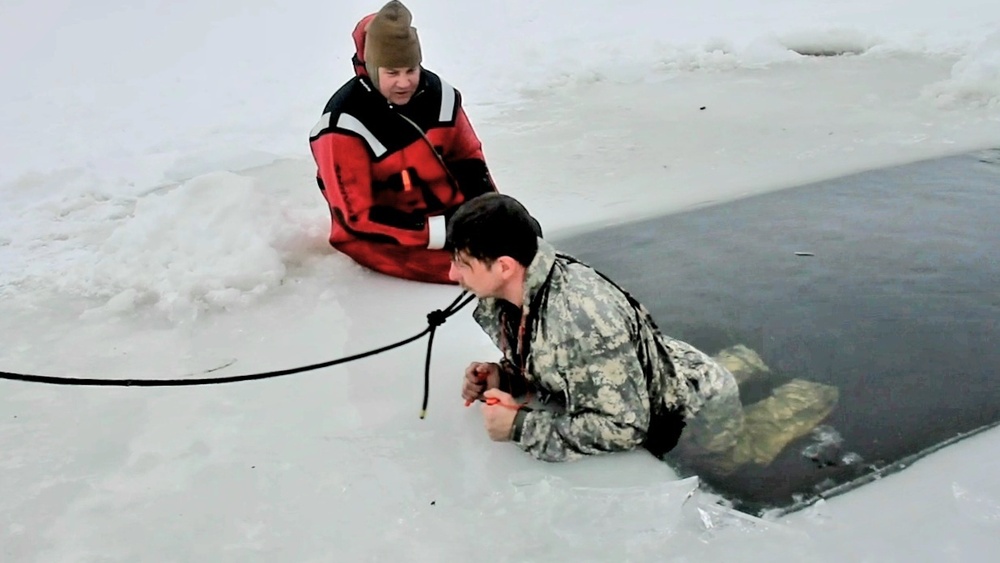 Airmen jump in icy Fort McCoy lake for January cold-water immersion training