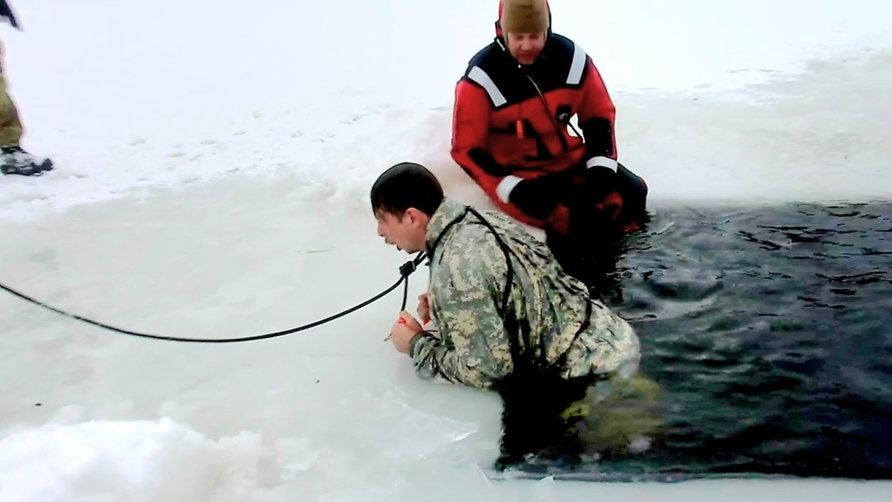 Airmen jump in icy Fort McCoy lake for January cold-water immersion training