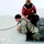Airmen jump in icy Fort McCoy lake for January cold-water immersion training