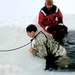 Airmen jump in icy Fort McCoy lake for January cold-water immersion training