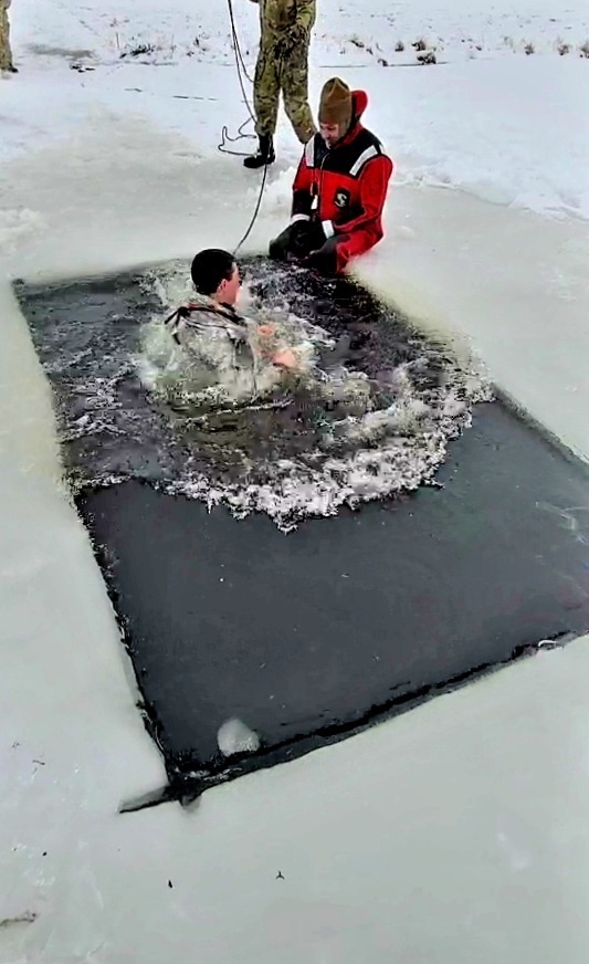 Airmen jump in icy Fort McCoy lake for January cold-water immersion training