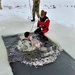 Airmen jump in icy Fort McCoy lake for January cold-water immersion training