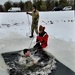 Airmen jump in icy Fort McCoy lake for January cold-water immersion training