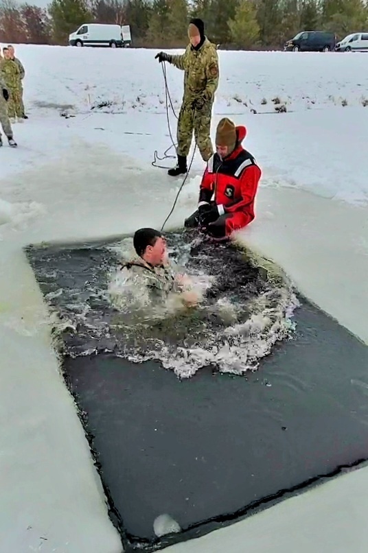 Airmen jump in icy Fort McCoy lake for January cold-water immersion training