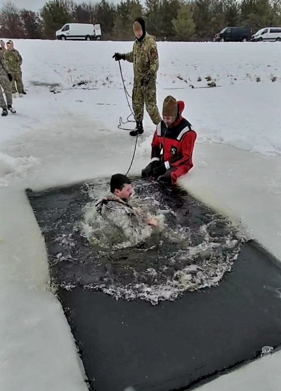 Airmen jump in icy Fort McCoy lake for January cold-water immersion training