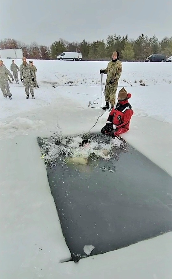 Airmen jump in icy Fort McCoy lake for January cold-water immersion training