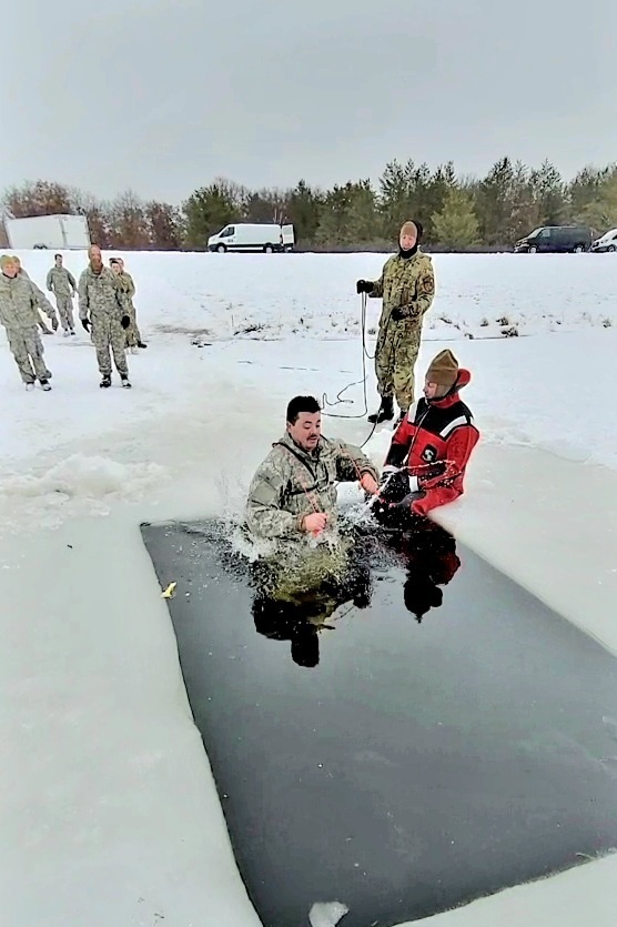 Airmen jump in icy Fort McCoy lake for January cold-water immersion training