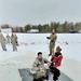 Airmen jump in icy Fort McCoy lake for January cold-water immersion training