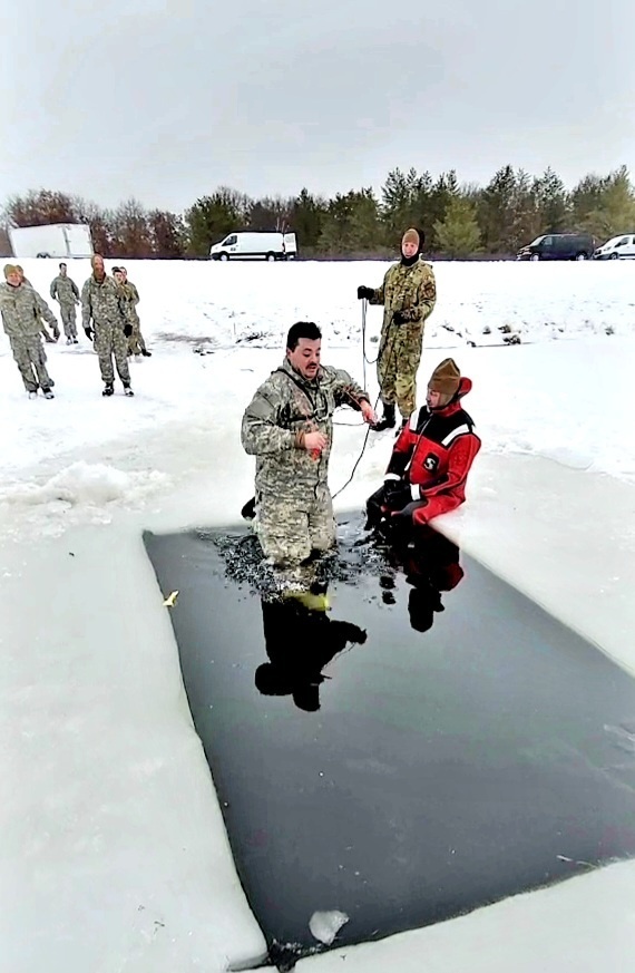 Airmen jump in icy Fort McCoy lake for January cold-water immersion training