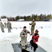 Airmen jump in icy Fort McCoy lake for January cold-water immersion training