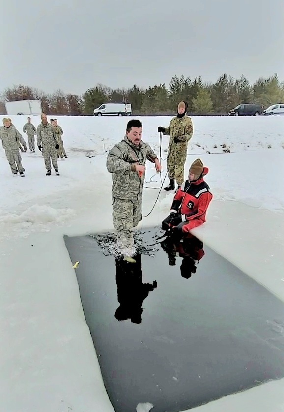 Airmen jump in icy Fort McCoy lake for January cold-water immersion training