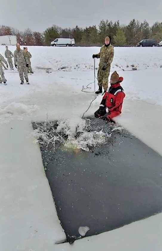 Airmen jump in icy Fort McCoy lake for January cold-water immersion training