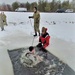 Airmen jump in icy Fort McCoy lake for January cold-water immersion training