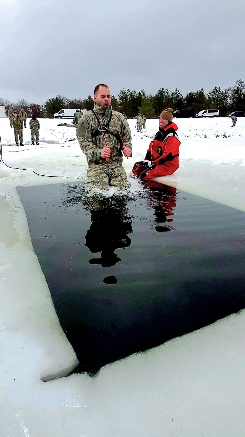 Airmen jump in icy Fort McCoy lake for January cold-water immersion training