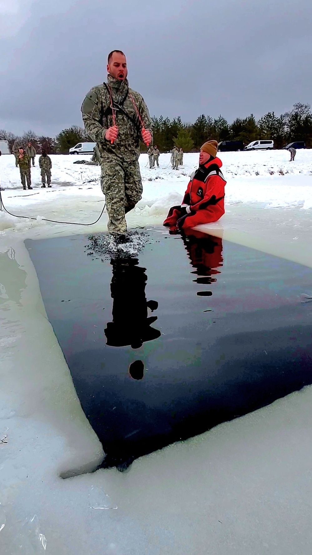 Airmen jump in icy Fort McCoy lake for January cold-water immersion training